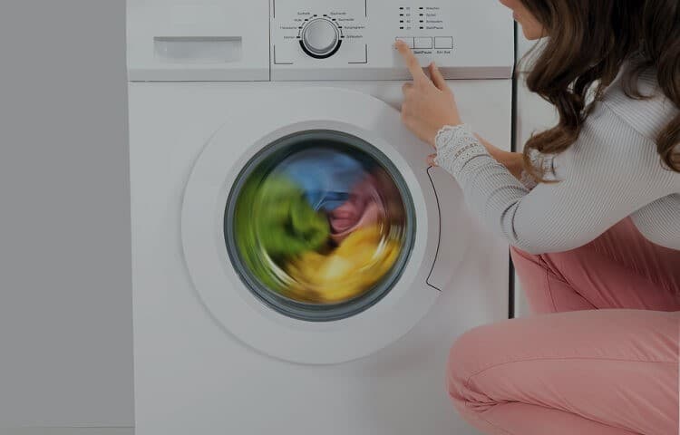 A girl using Fully Automatic Washing Machine